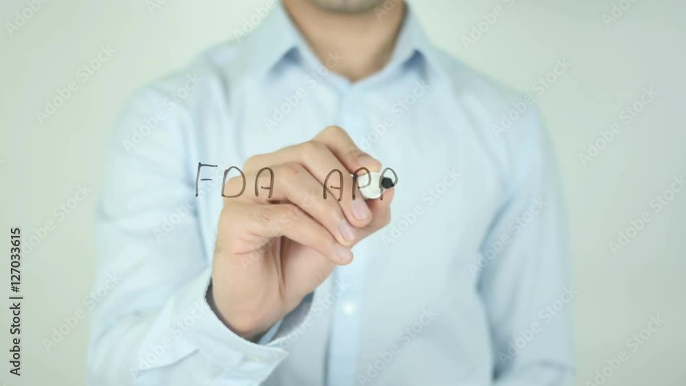 FDA Approved, Man Writing on Screen FDA Approved, Man Writing on Screen