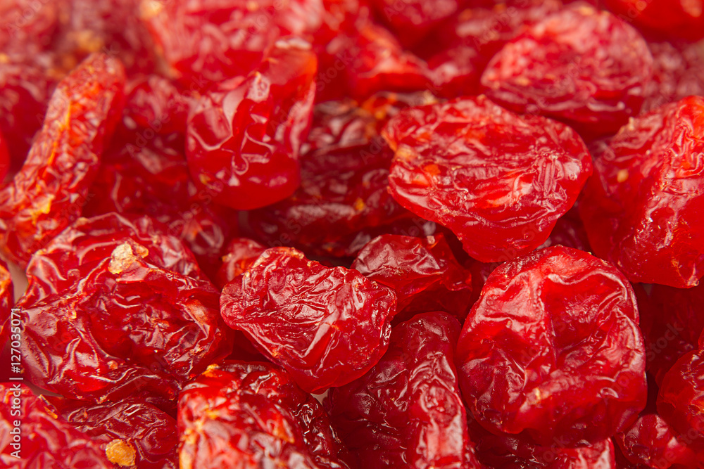 Dried cherries close up background. Heap of glossy red cherry. Top view. Dried cherries close up background. Heap of glossy red cherry. Top view.