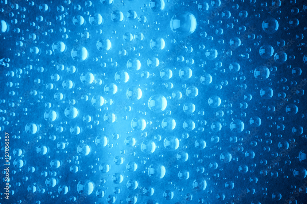 Blue water drops of on treat water-repellent surface in macro lens shot small-DOF for screen wallpapers Blue water drops of on treat water-repellent surface in macro lens shot small-DOF for screen wallpapers