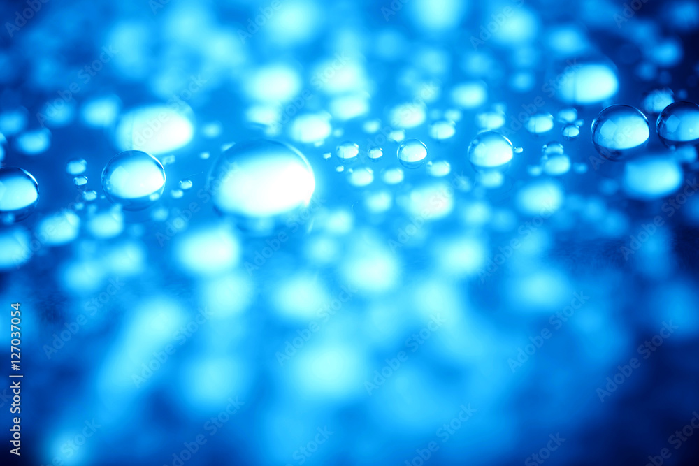 Blue water drops of on treat water-repellent surface in macro lens shot small-DOF for screen wallpapers Blue water drops of on treat water-repellent surface in macro lens shot small-DOF for screen wallpapers