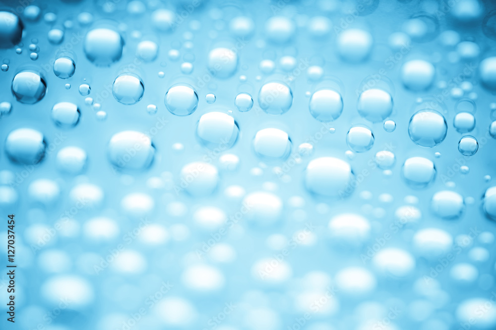 Blue water drops of on treat water-repellent surface in macro lens shot small-DOF for screen wallpapers Blue water drops of on treat water-repellent surface in macro lens shot small-DOF for screen wallpapers