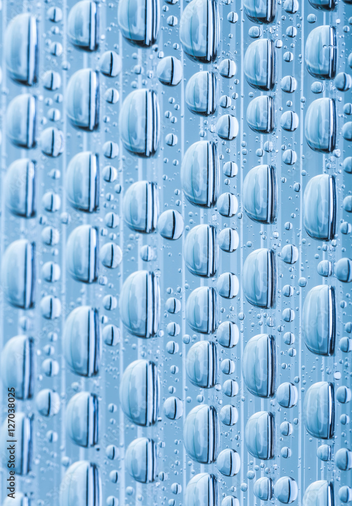 Blue water drops of on treat water-repellent surface in macro lens shot small-DOF for screen wallpapers Blue water drops of on treat water-repellent surface in macro lens shot small-DOF for screen wallpapers