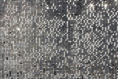 Silver background mosaic with light spots and stars