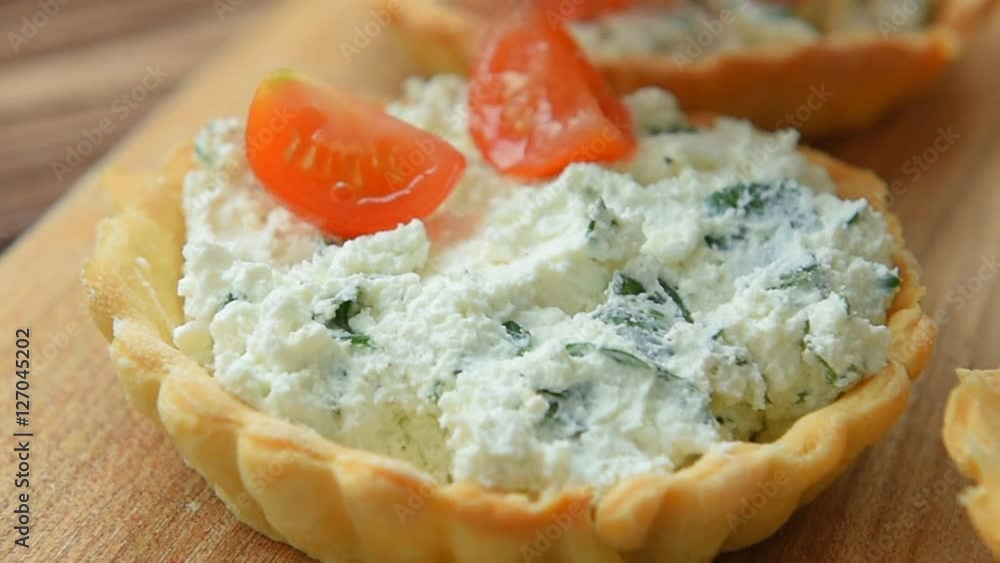 Homemade tartlet with feta, spinach and cherry tomatoes Homemade tartlet with feta, spinach and cherry tomatoes