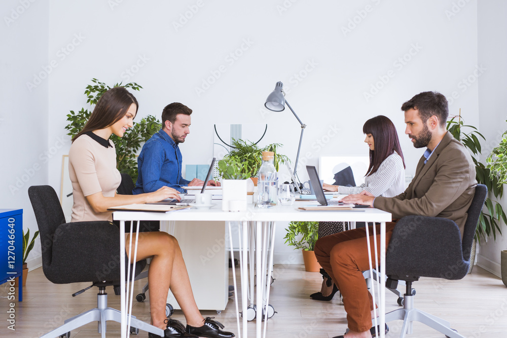 Men and women working in office Men and women working in office