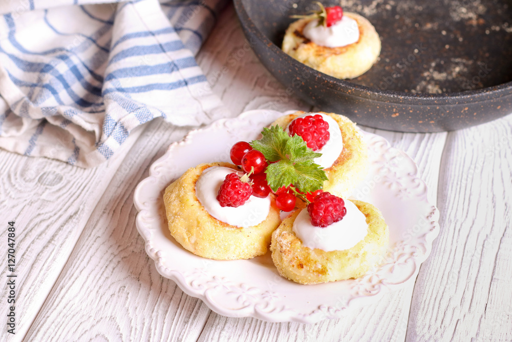 Cheese pancake, syrniki with raspberry and red currant