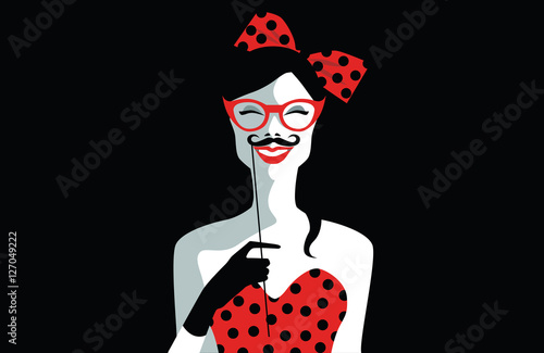 Beautiful young woman with sunglasses, retro style holding funny mustache on stick. Joyful young girl ready for party. Pop art. Vector eps10 illustration photo