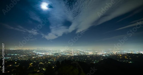 Los Angeles, California, USA - view from Griffith Observatory at City of Los Angeles facing south at clear night with moonlight and a few moving clouds - Timelapse without motion