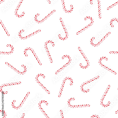 Vector seamless pattern with candy canes. Red striped Christmas peppermint sticks on white background.