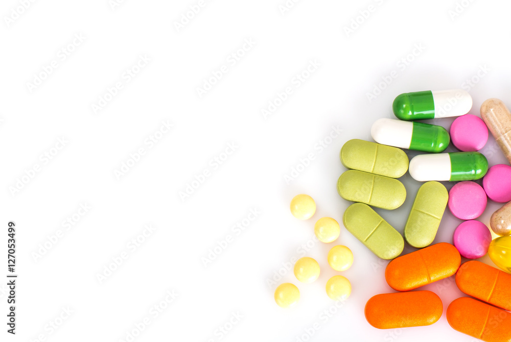 Colored capsules, pills and medical glass bottle