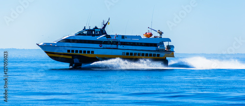 hydrofoil boat runs at full speed on the sea waves