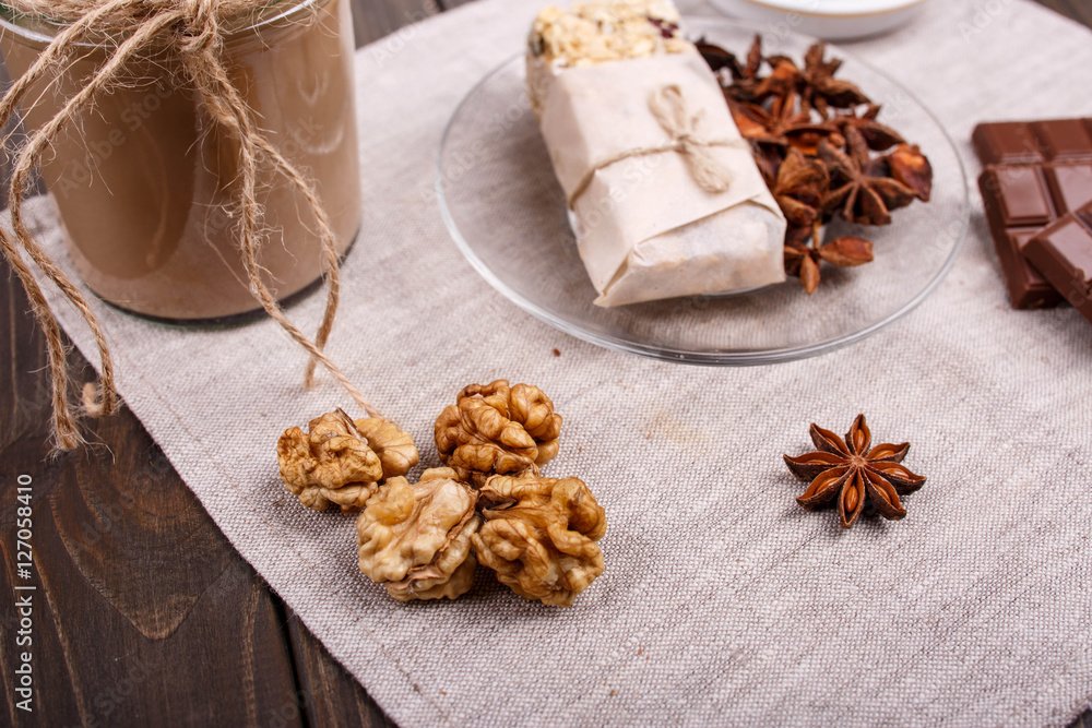 Fototapeta premium detox coctail with walnut,grain clove and chocolate lie on the t