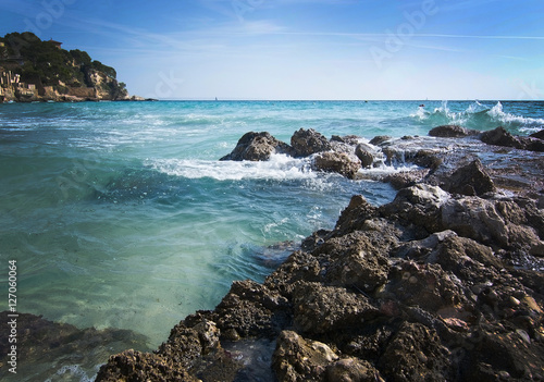 Rock pier and splashing waves