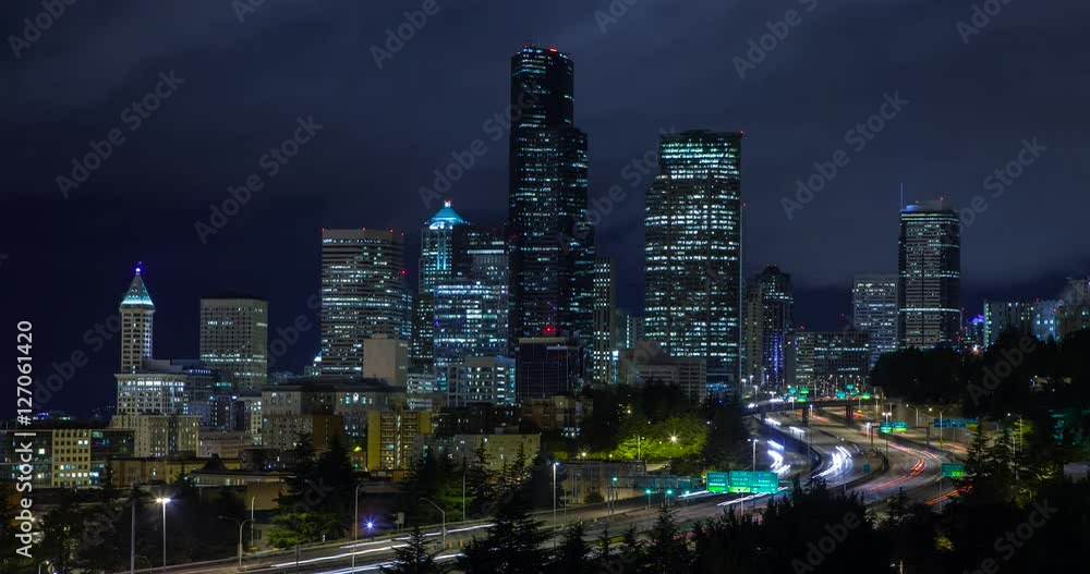 Seattle, Washington, USA - illuminated skyline of Seattle as seen from Dr. Jose Rizal Park with Interstate 5 at night with moving clouds - Timelapse without motion Seattle, Washington, USA - illuminated skyline of Seattle as seen from Dr. Jose Rizal Park with Interstate 5 at night with moving clouds - Timelapse without motion