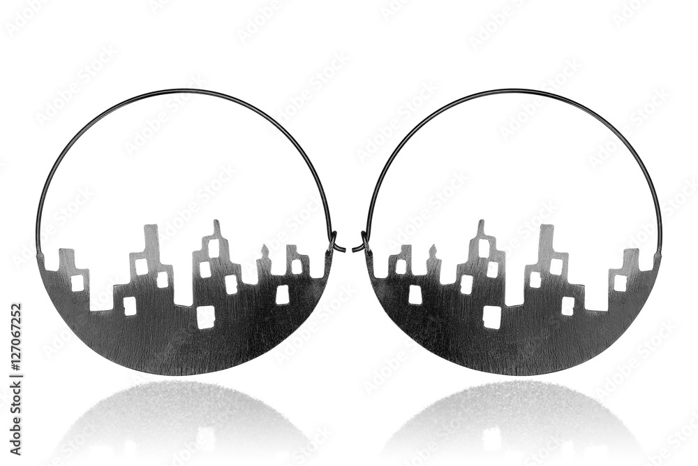 Fototapeta premium Silver earrings on white background