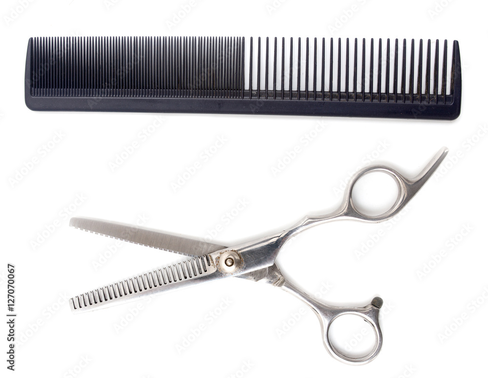 Comb with scissors on a white background Comb with scissors on a white background
