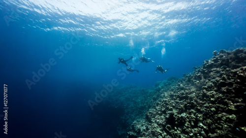 Divers crossing over the Dahab bluehole photo