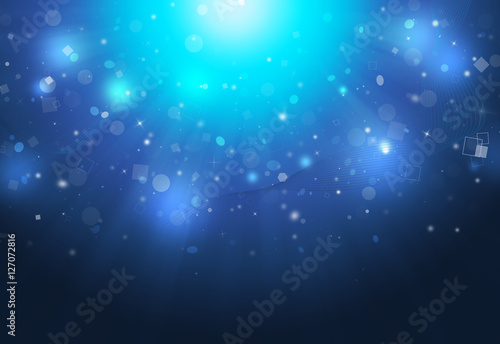 Blue glitter sparkles defocused rays lights bokeh down abstract background/texture.