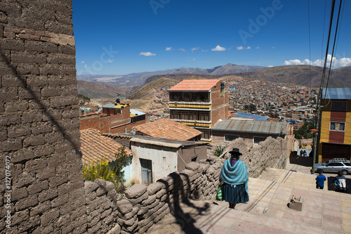 Potosi, Bolivia - November 29, 2013: Woman wearing traditional clothes in the city of Potosi in Bolivia.  photo