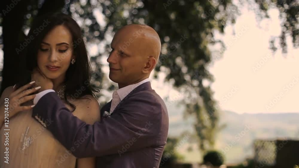 Devine woman enjoys man's touch standing on backyard Devine woman enjoys man's touch standing on backyard
