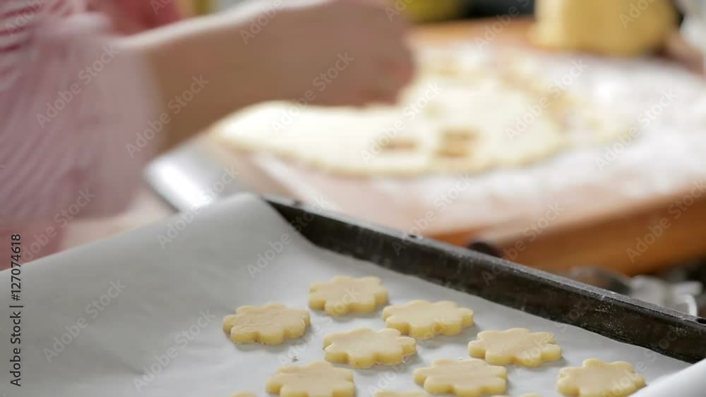 woman preparing christmas sugar cookies in the kitchen woman preparing christmas sugar cookies in the kitchen