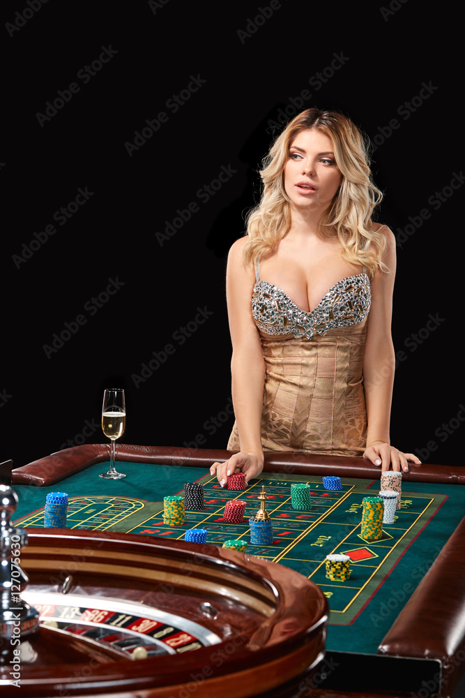 woman in a smart dress plays roulette. woman in a smart dress plays roulette.