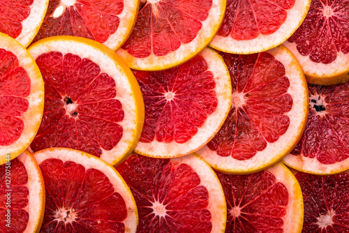 Texture of grapefruit slices, overhead, close up, citrus backgrounds