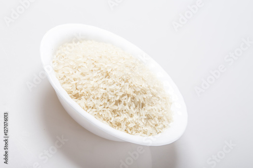 Bowl full of rice on white 
