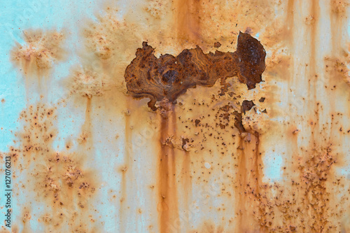 Rusted metal plate with old painted surface texture