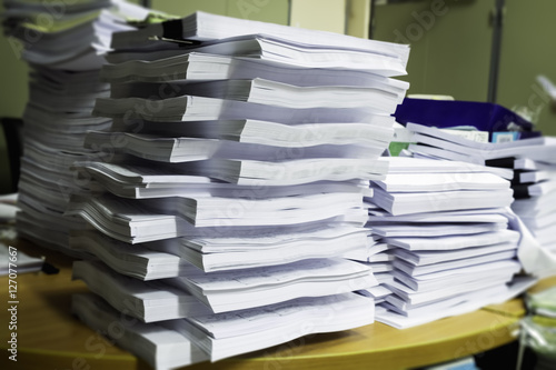 Pile of unfinished documents on office desk, Stack of business p