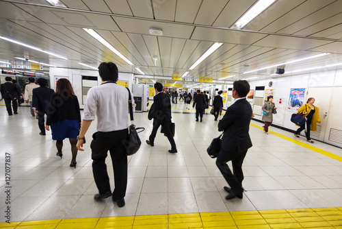 Passengers in hurry at Tokyo subway station photo