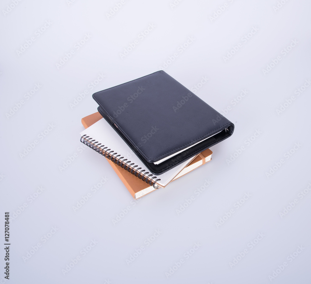 notebook or black leather notebook on the blackground.