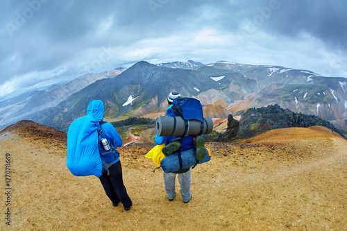 hikers on the trail in the Islandic mountains. Trek in National Park Landmannalaugar, Iceland photo