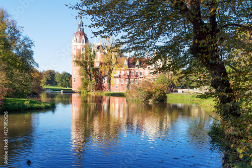 Muskau Palace reflected in the lake in the Lusatia, Germany © kelifamily
