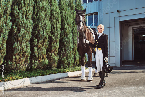 woman jockey with his horse