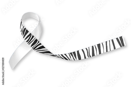 Carcinoid Cancer Awareness ribbon zebra stripe pattern on helping hand & old aged wood background: Satin fabric loop symbolic logo raising support help people with tumor illness in November
 photo