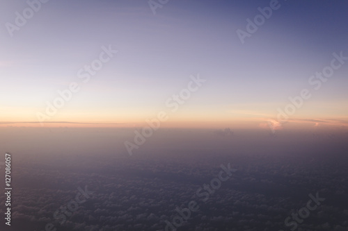 colorful gradient sky just before sunrise view form airplane with copyspace