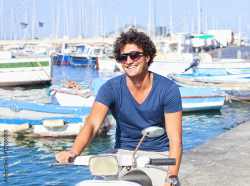 Young Italian Man on Vespa Scooter Smiling