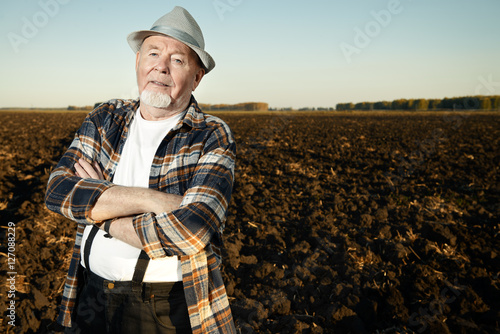 farmer in a plowed field