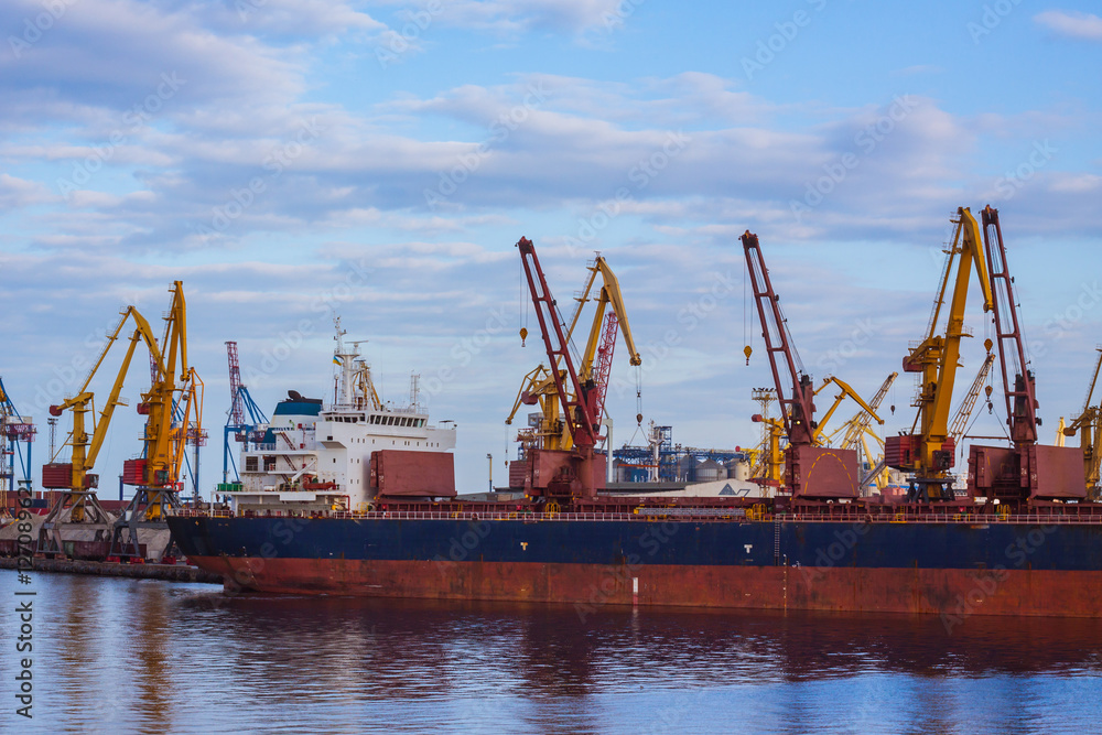 sea cargo terminal with ship, cranes and containers