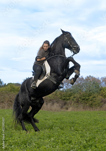 riding girl and black stallion © cynoclub