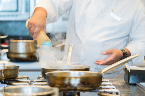 chef preparing food in a restaurant kitchen 