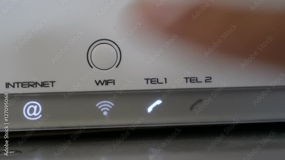 Human finger pressing wireless device button 4K 2160p 30fps UltraHD footage - On white Internet router Wi-Fi signal turning ON 3840X2160 UHD video Human finger pressing wireless device button 4K 2160p 30fps UltraHD footage - On white Internet router Wi-Fi signal turning ON 3840X2160 UHD video