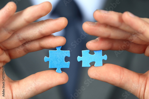 Hands with two puzzles