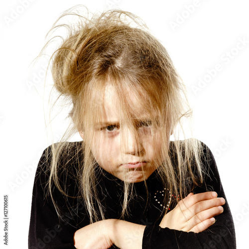 Photos Disheveled preschooler girl with stupid face