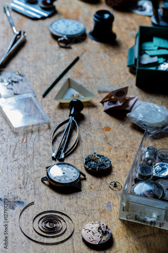 mixed tools and instruments of a watchmaker