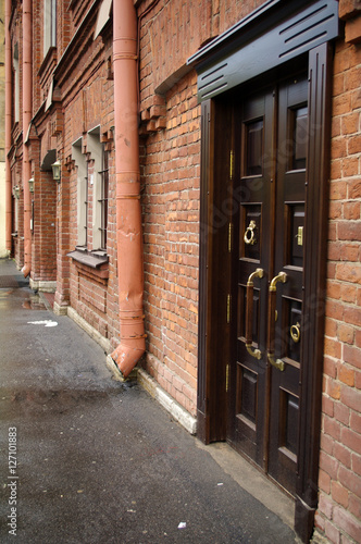 Old door in rustic brick wall  Saint Petersburg  Russia