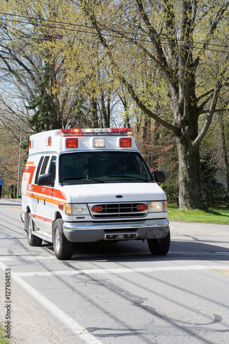 Emergency Ambulance Vehicle – An ambulance drives down the road. © Cathleen