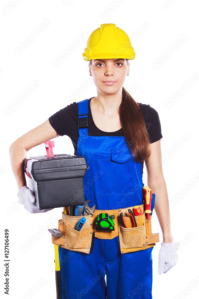 Woman builder in the uniform with a toolbox Woman builder in the uniform with a toolbox