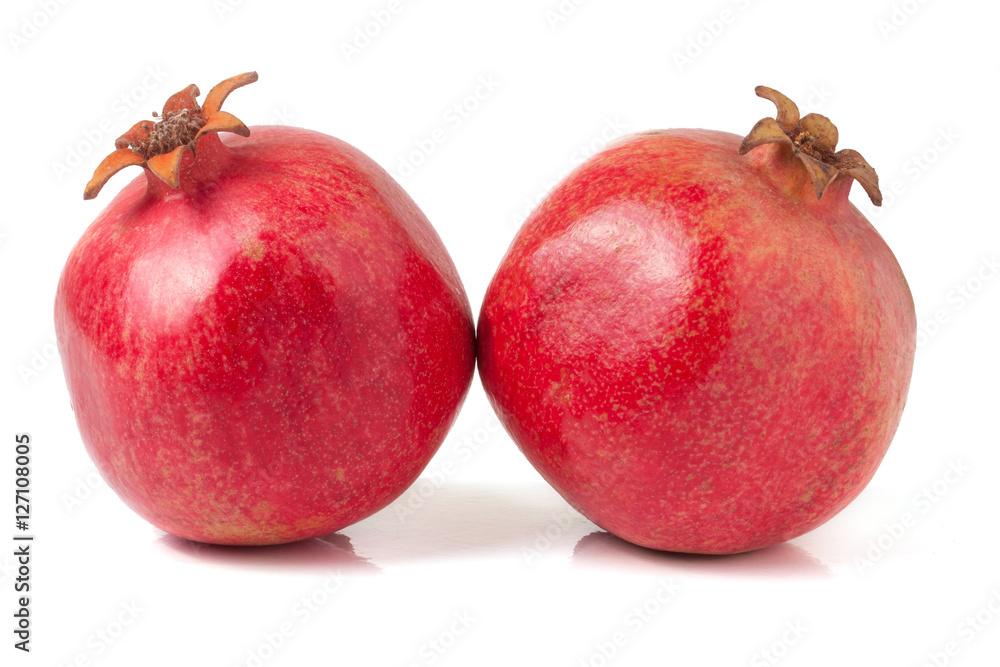 Fototapeta premium two pomegranate isolated on a white background